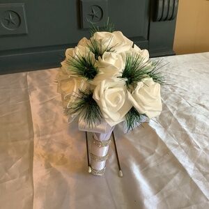 Winter pine and real touch rose bouquet